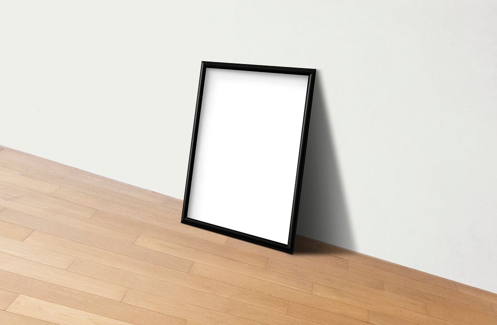 Black frame mockup against a white wall