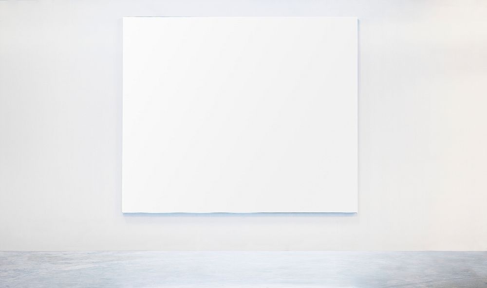 White frame mockup on a white wall