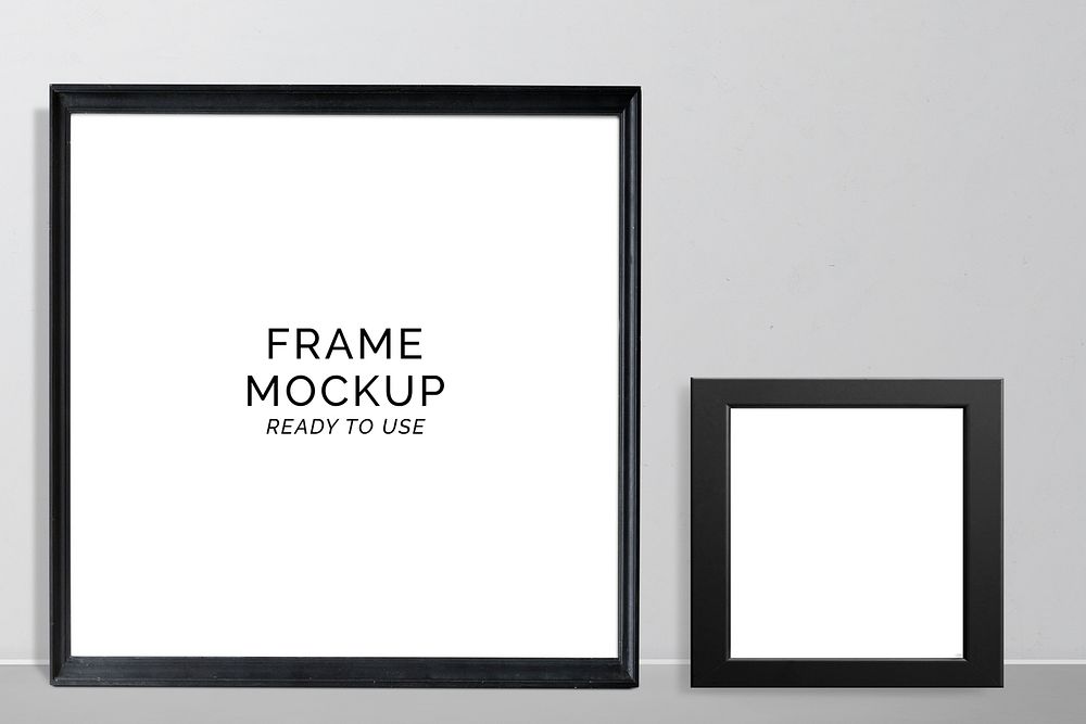 Black frame mockups against a gray wall