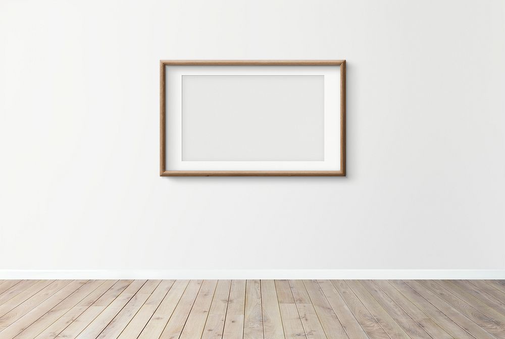Blank frame mockup on a white wall