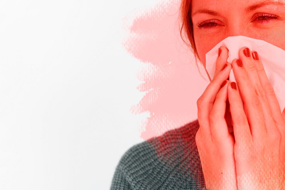 Sick woman sneezing and spreading the virus