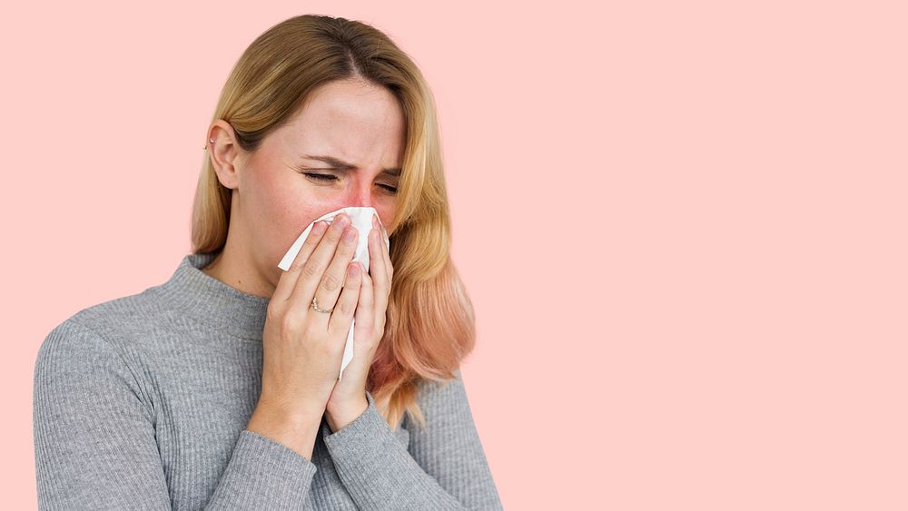 Sneezing woman with coronavirus symptoms
