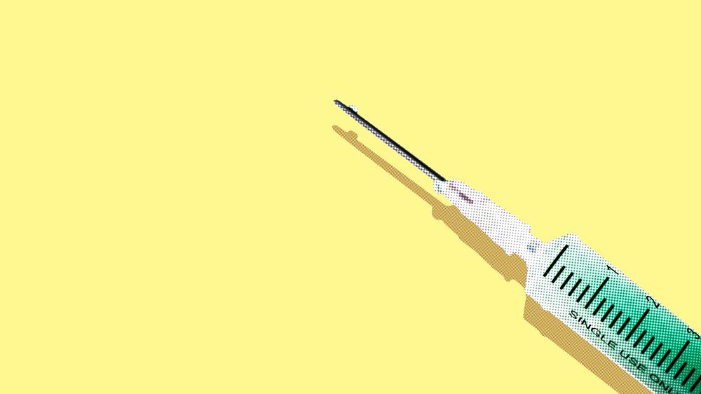 Syringe with a green solution on a yellow background