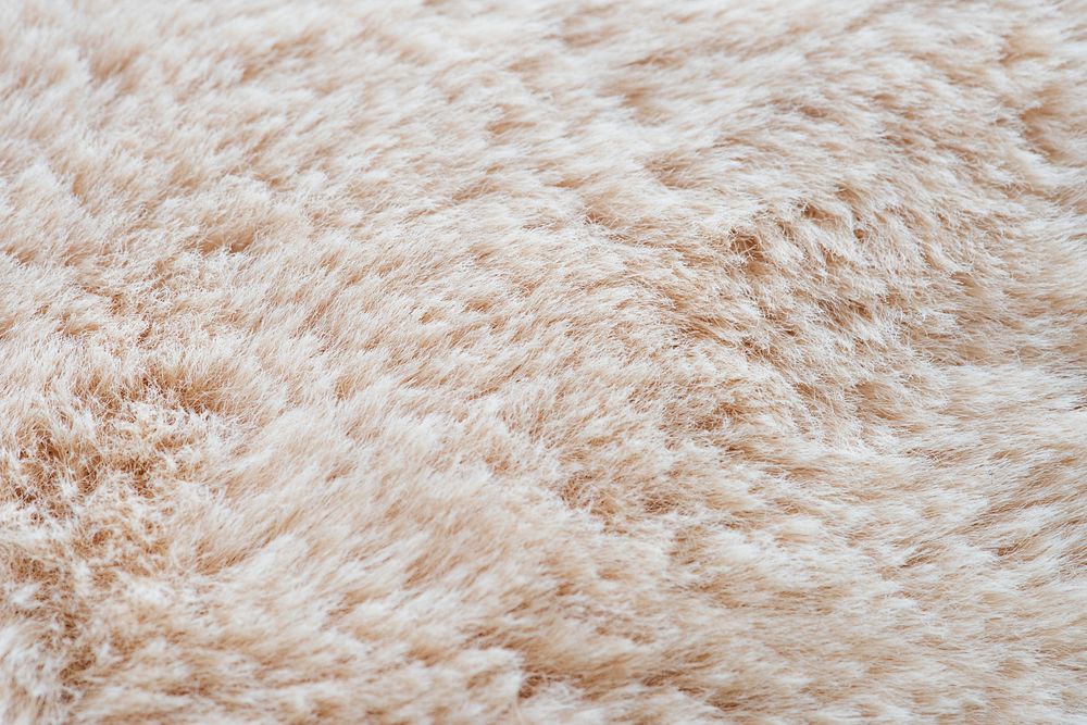 Nude fluffy fur textured background