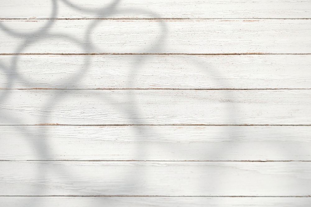 White wooden plank with shadows background