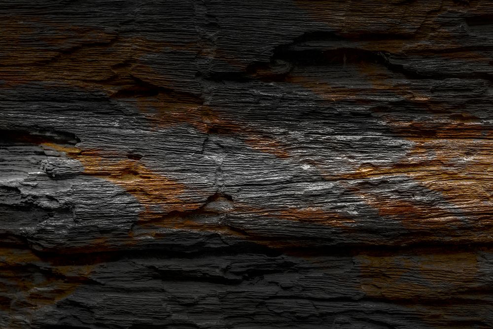 Black wooden plank with brown textured background