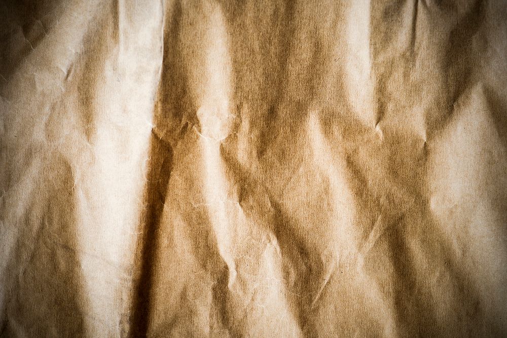 Brown scrunched paper textured background
