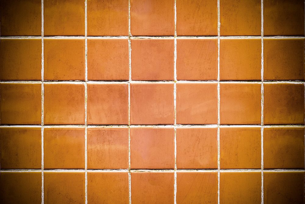 Vignette brownish orange tiles textured background