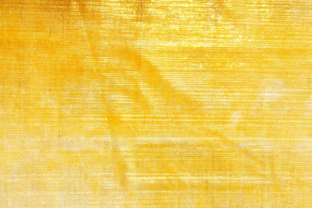 Shiny gold fabric textured background