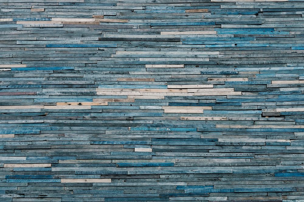 Faded blue wooden piles textured background