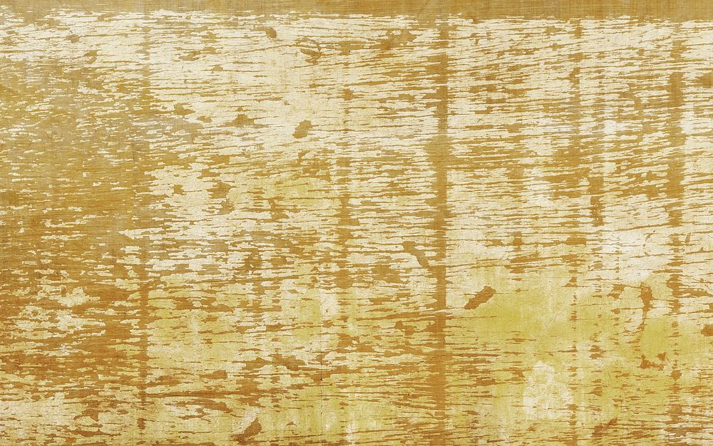 Rustic gold paint on a wooden background