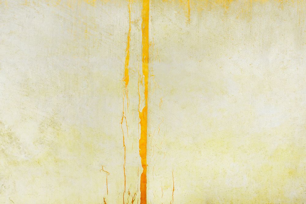Pale yellow paint on a concrete wall