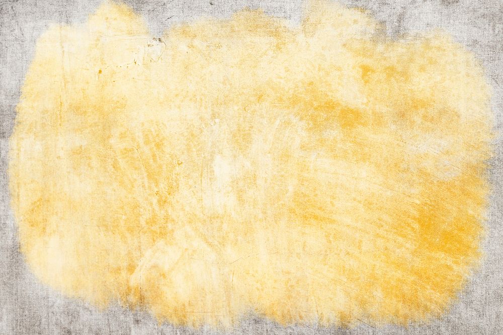 Grunge yellow paint on a concrete textured background