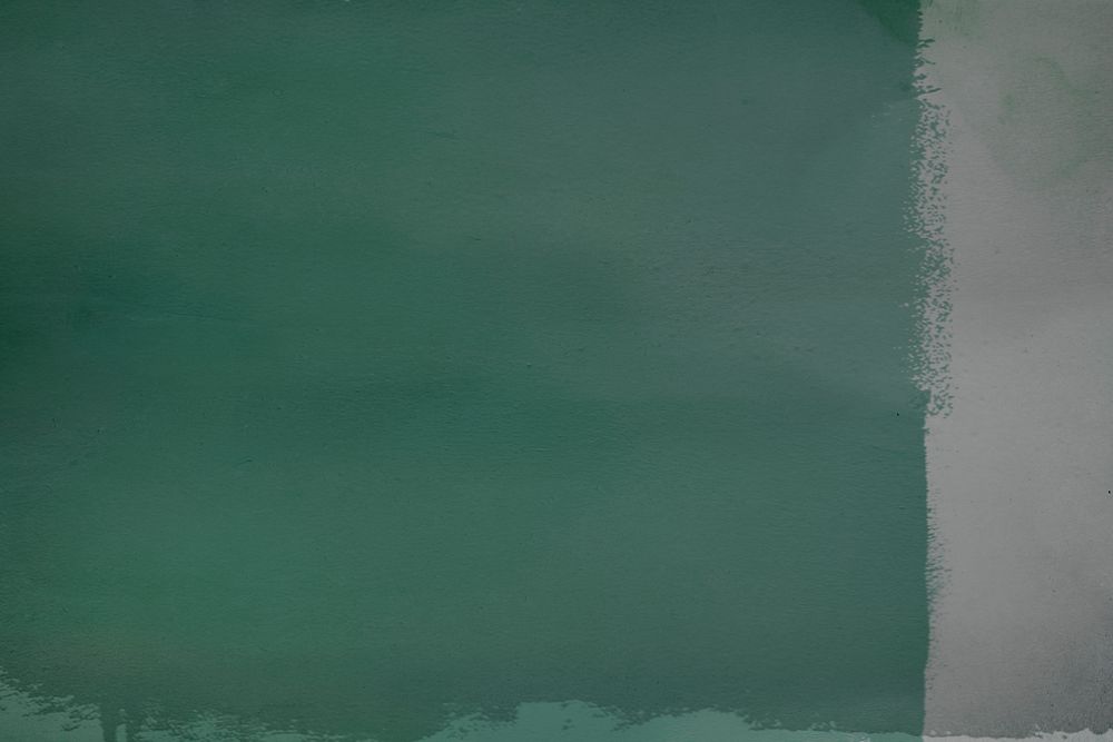 Blank green paint on a gray wall