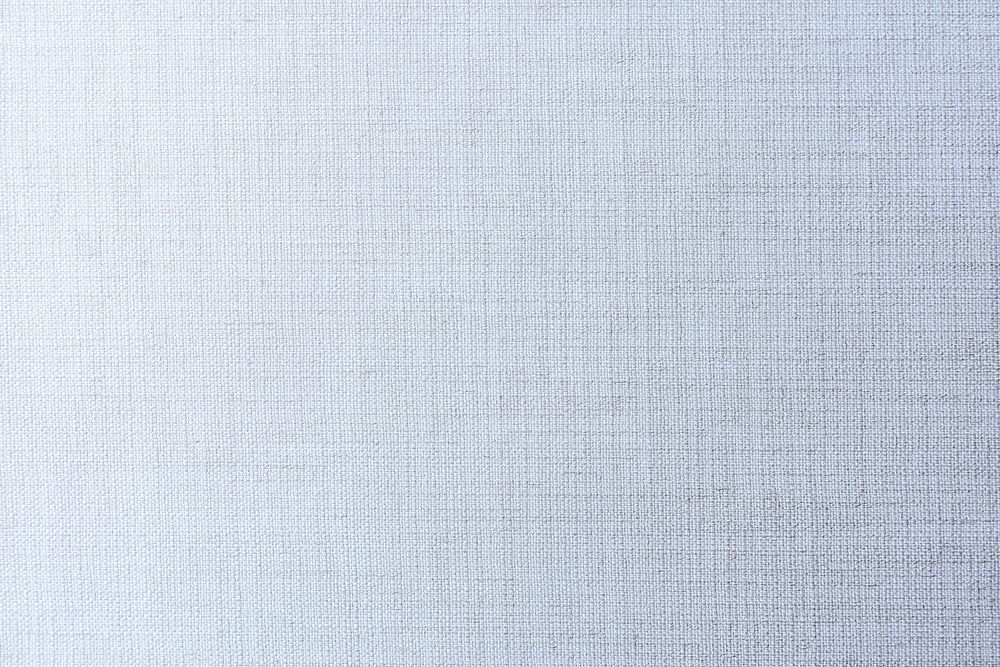 Plain faded blue matt weave fabric textured background