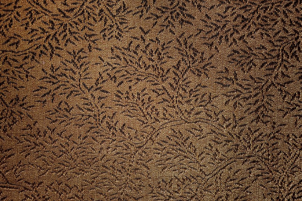 Dark brown leaf embroidered fabric fabric textured background