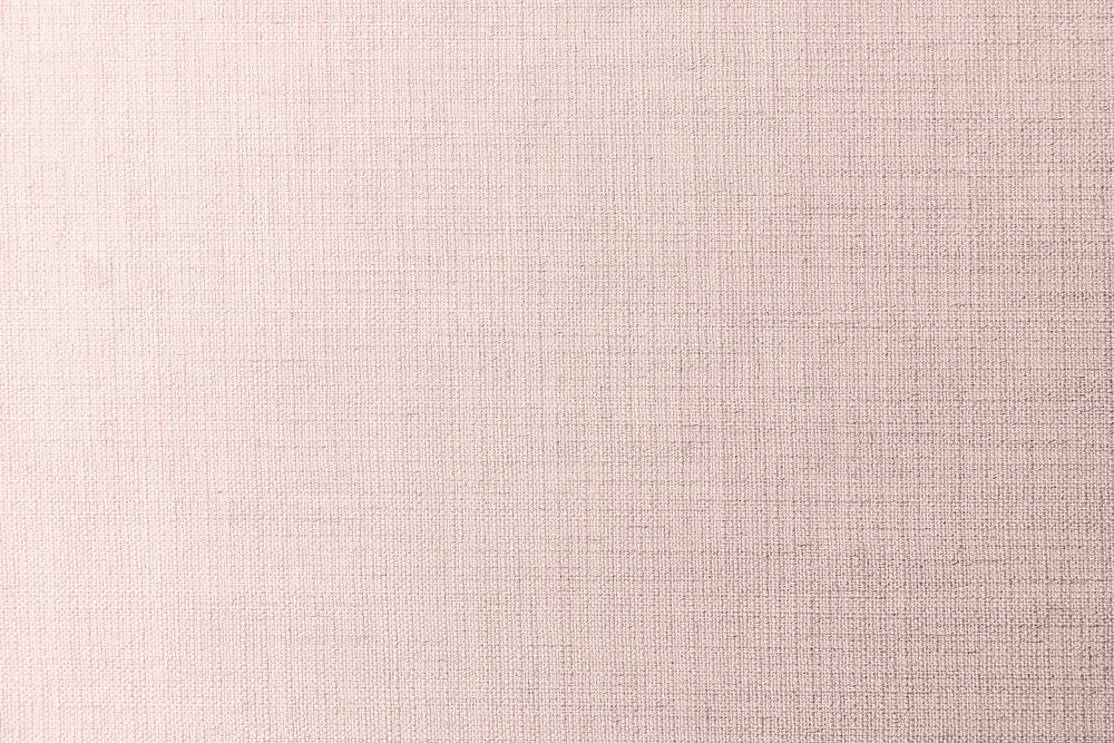 Plain pale pink fabric textured background