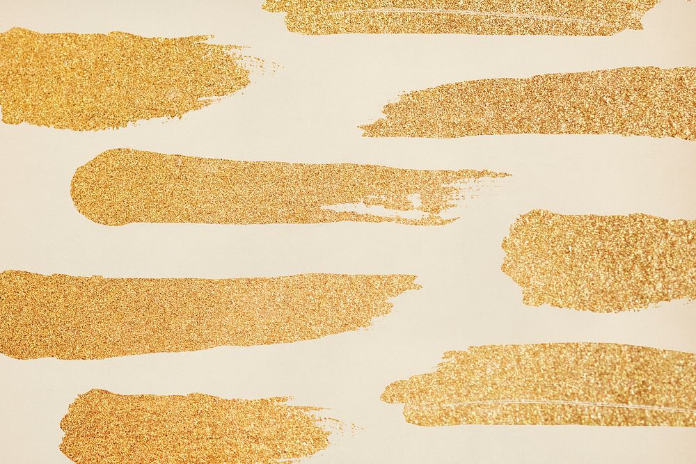 Gold glittery paintbrush stoke background