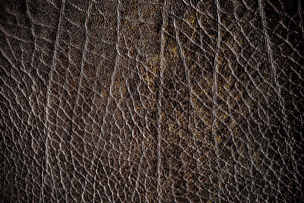Brown creased leather textured background