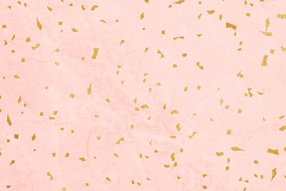 Golden confetti on a marble textured background