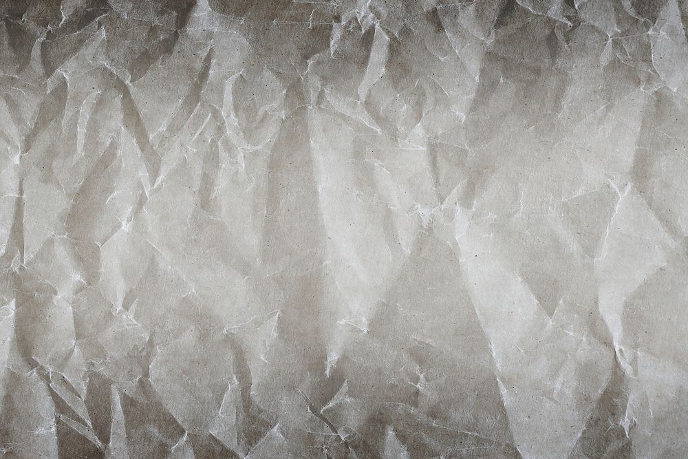 Crumpled white paper textured background