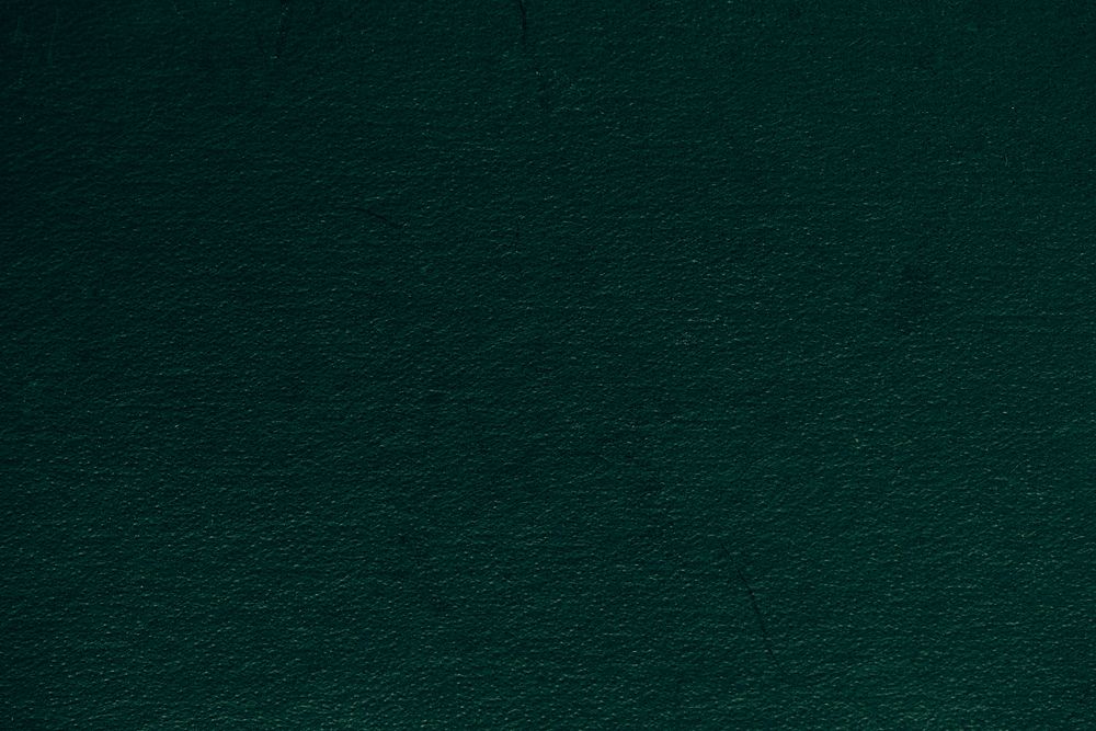 Rough green textured paper background