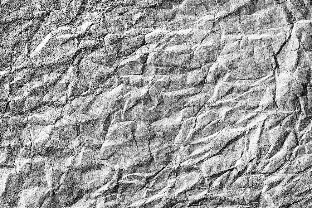 Grungy crumpled textured paper background