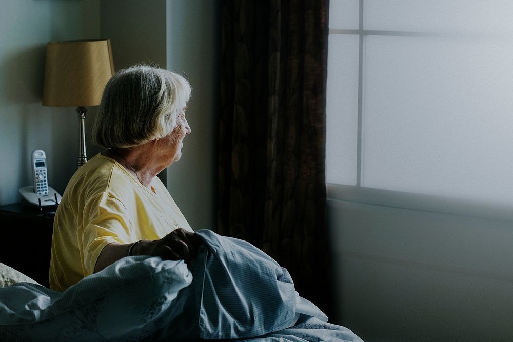 Elderly woman alone at home during social isolation