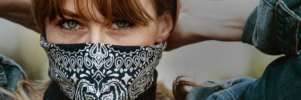 Woman covering her mouth and nose with a bandana during the coronavirus outbreak