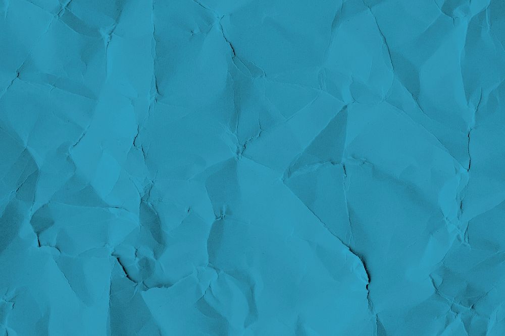 Crumpled blue paper textured background