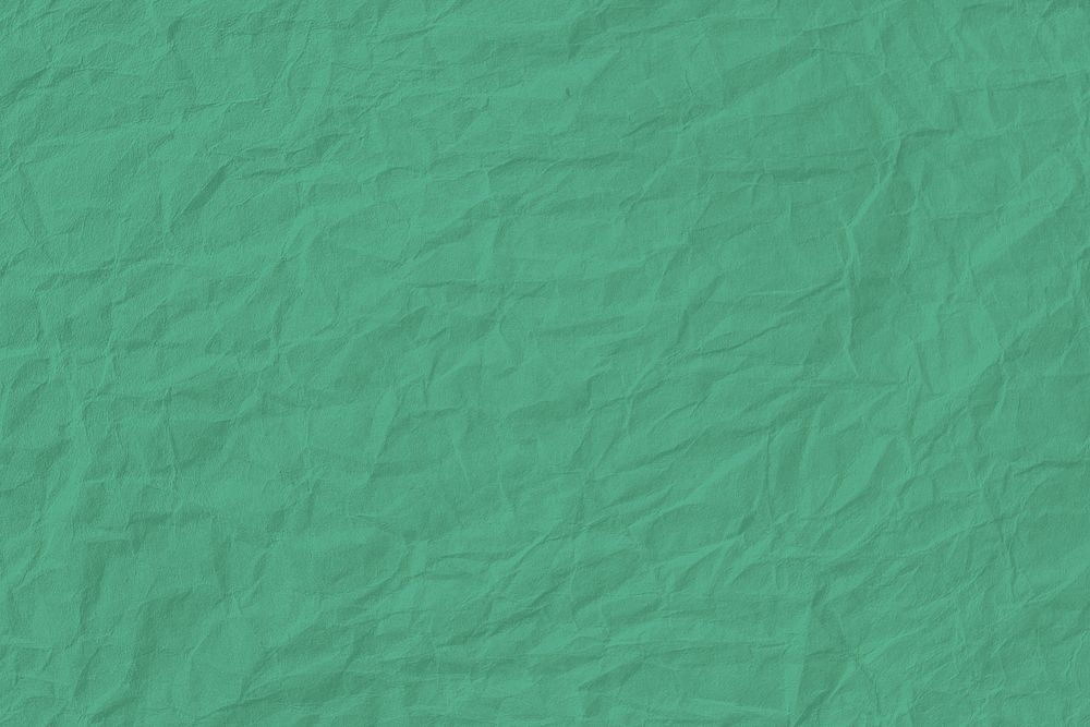 Crumpled mint green paper textured background