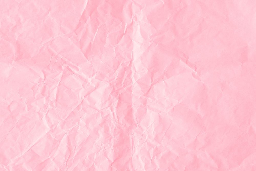 Crumpled flamingo pink paper textured background