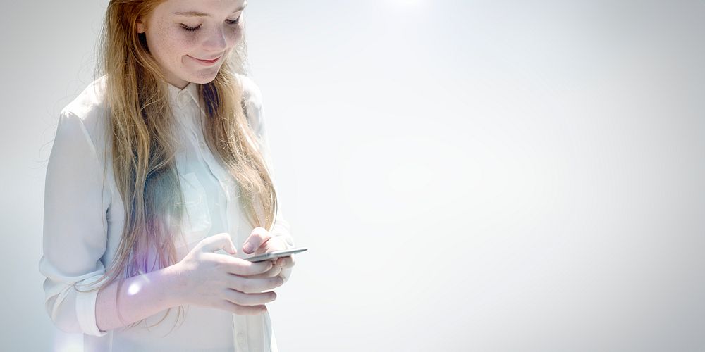 Young woman texting on her phone