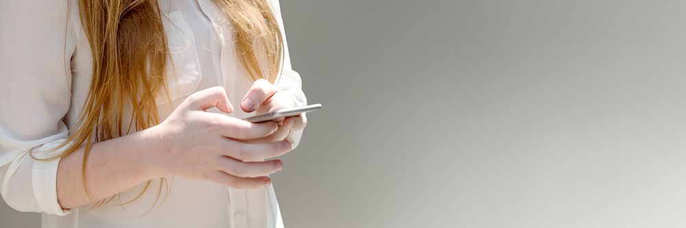 Young woman texting on her phone