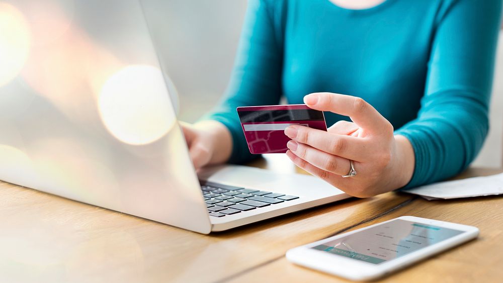 Woman pay online shopping with her card