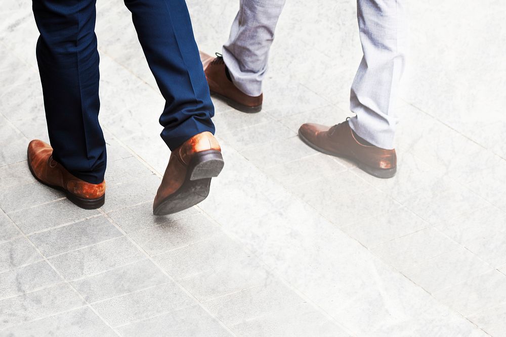 Business people walking on a pavement