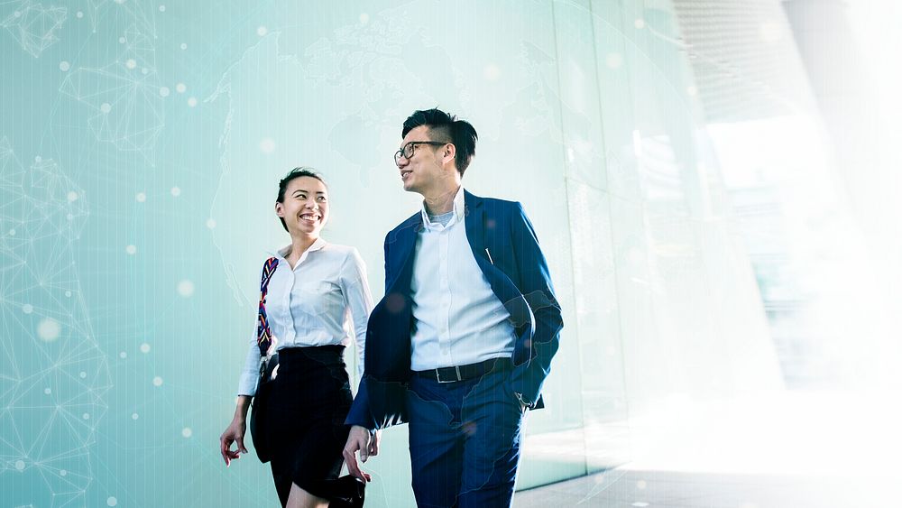 Asian business people in a discussion while walking
