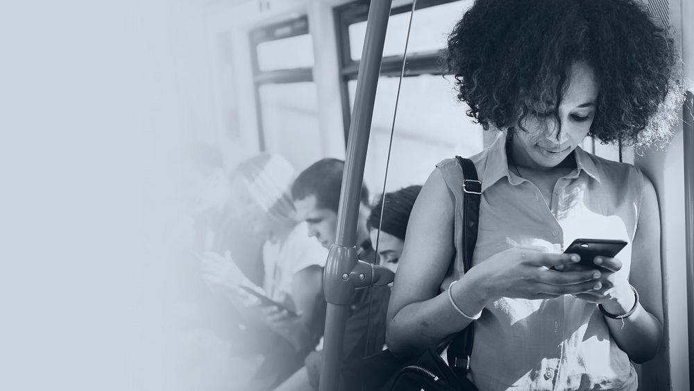 Young woman texting in a subway