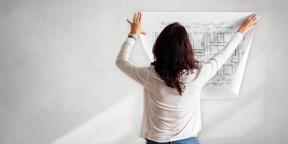 Female architect checking a blueprint