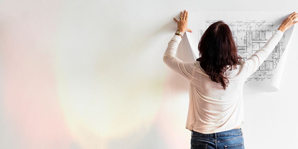 Female architect checking a blueprint