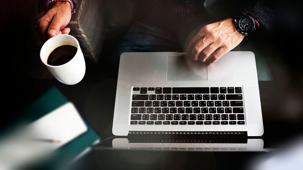 Man using a laptop in the morning