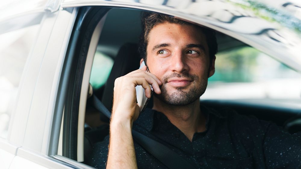 Man making a call in his car