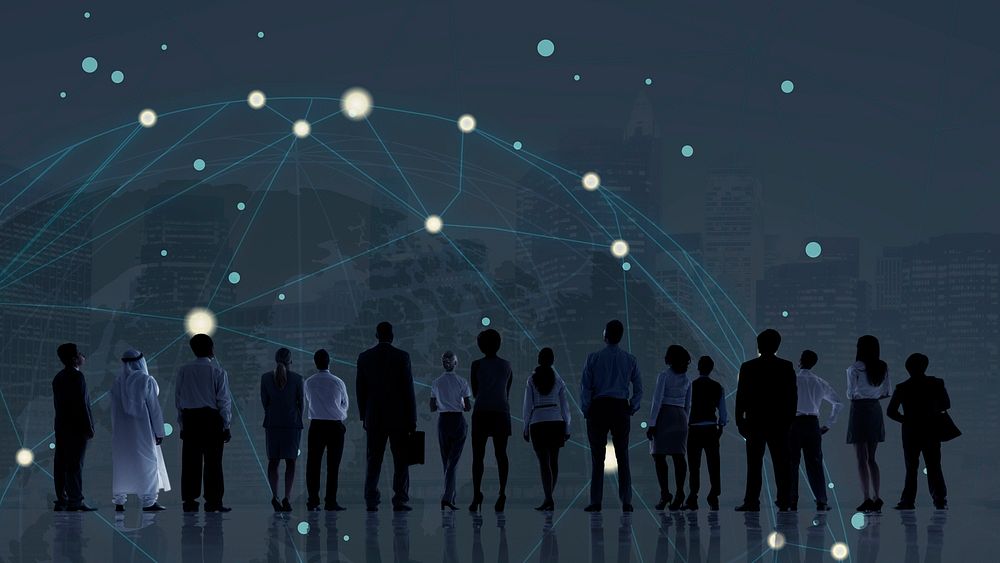 Silhouetted business people standing with  global networks background