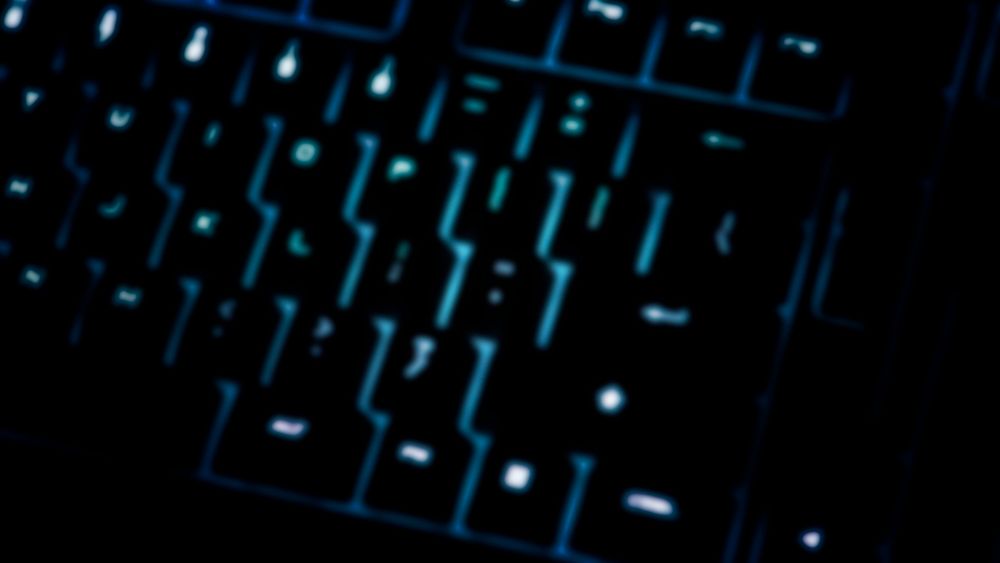 Closeup of a blurry black computer keyboard