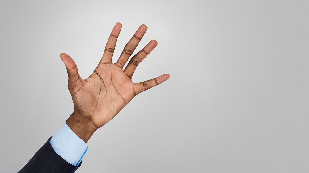 Businessman showing his hand in the air