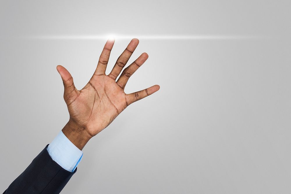 Businessman showing his hand in the air