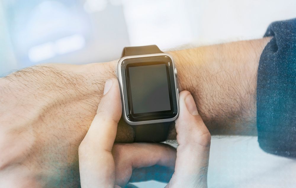 Man checking on his smartwatch