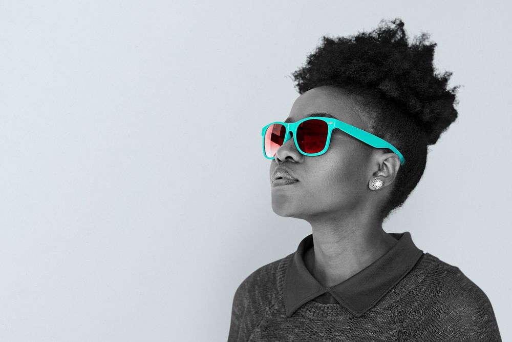 Black woman wearing a teal sunglasses