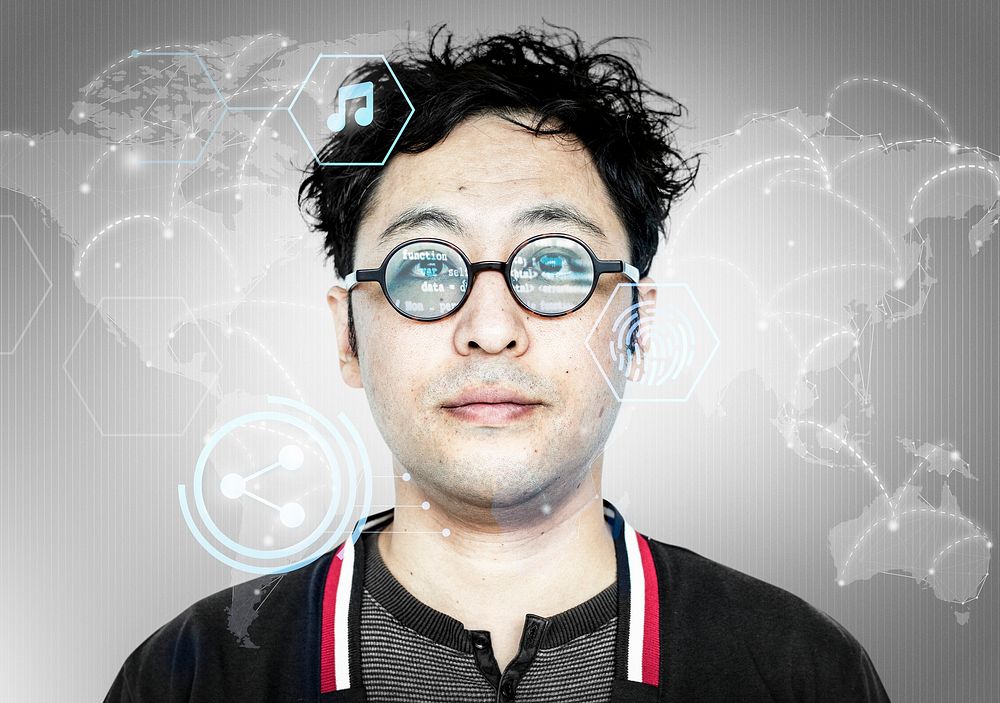 Asian hacker with computer code on his glasses