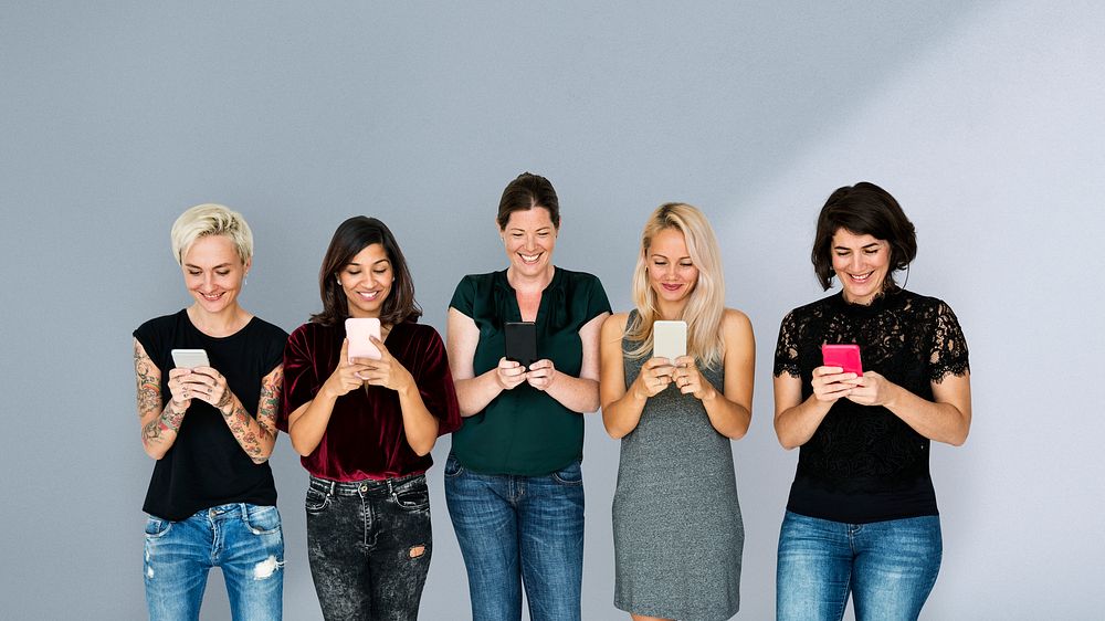Group of women texting on their phones